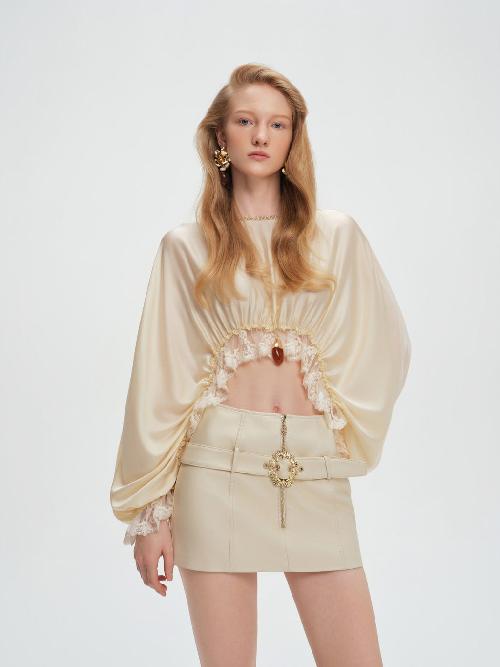 Leather mini skirt belt and pearl buckle detail